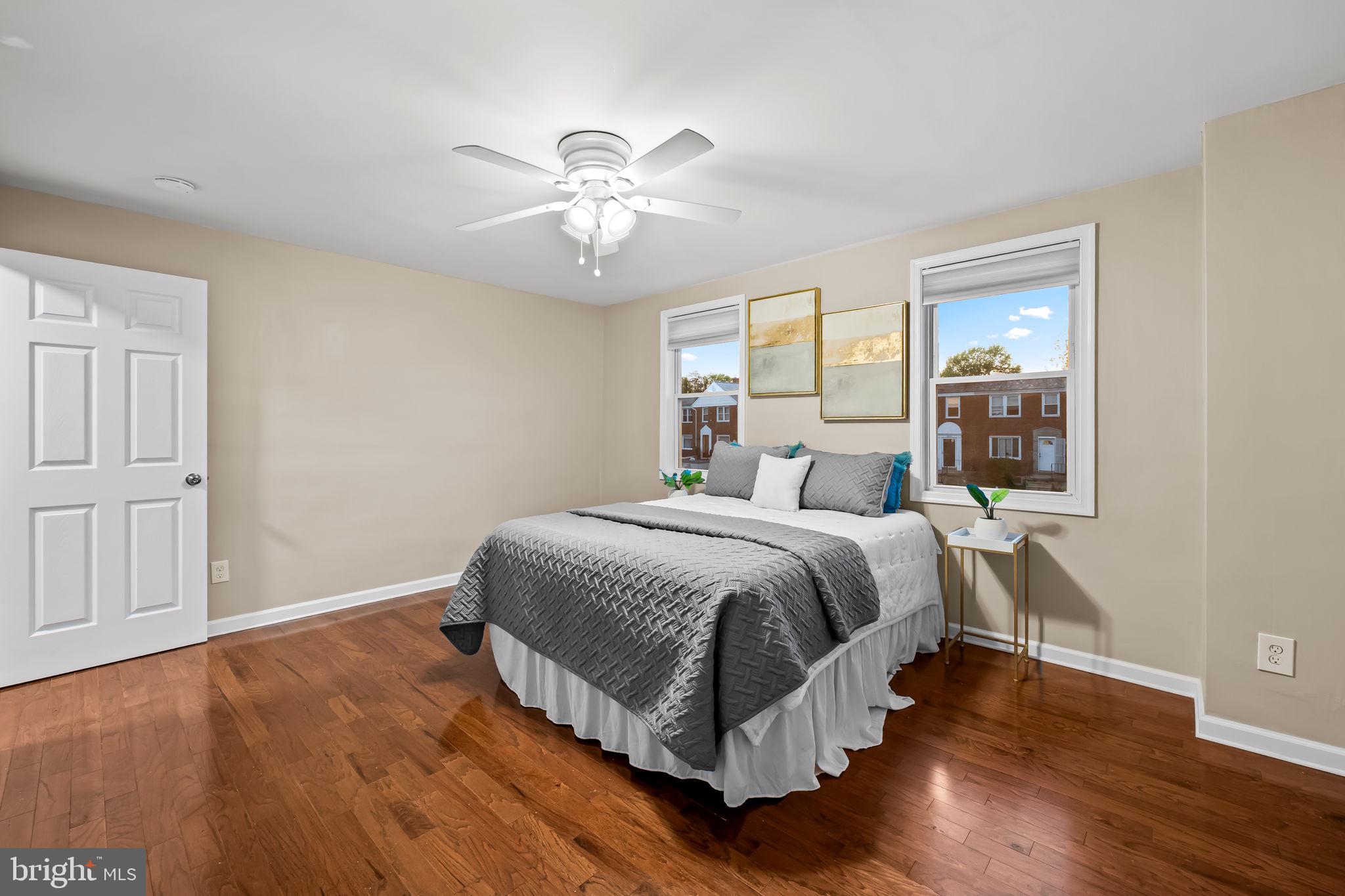 1817 Dunmere Road Baltimore, MD 21222 - Photo 20 of 27 a bedroom with a bed and wooden floor