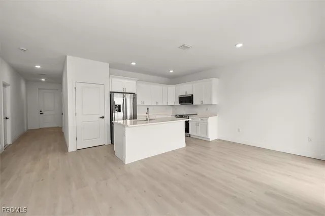 a view of kitchen with wooden floor