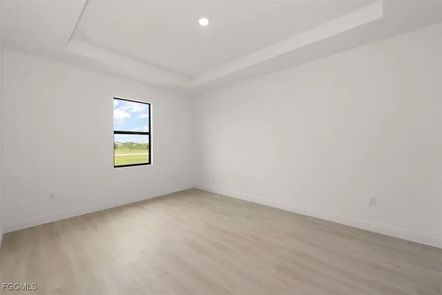 an empty room with windows and entrance