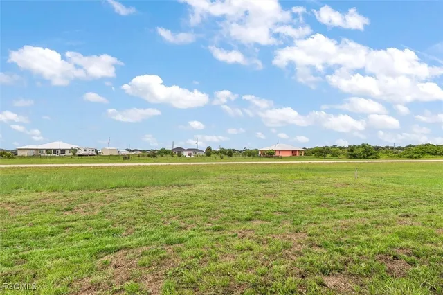a view of an ocean and a houses