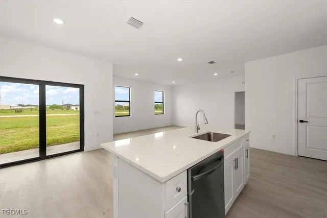 a kitchen with a sink and a refrigerator