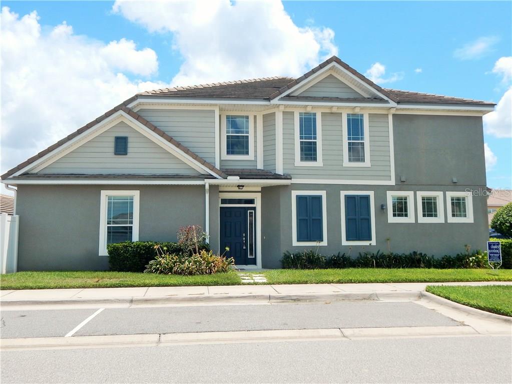 7451 Ripplepointe Way Windermere, FL 34786 - Photo 1 of 1 Exterior. End unit, detached garage and guest parking to the front