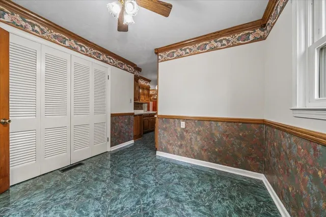 a view of empty room with floor to ceiling window