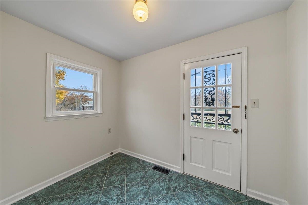 102 Linden Street Grand Junction, TN 38039 - Photo 16 of 37 Doorway to outside featuring healthy amount of natural light