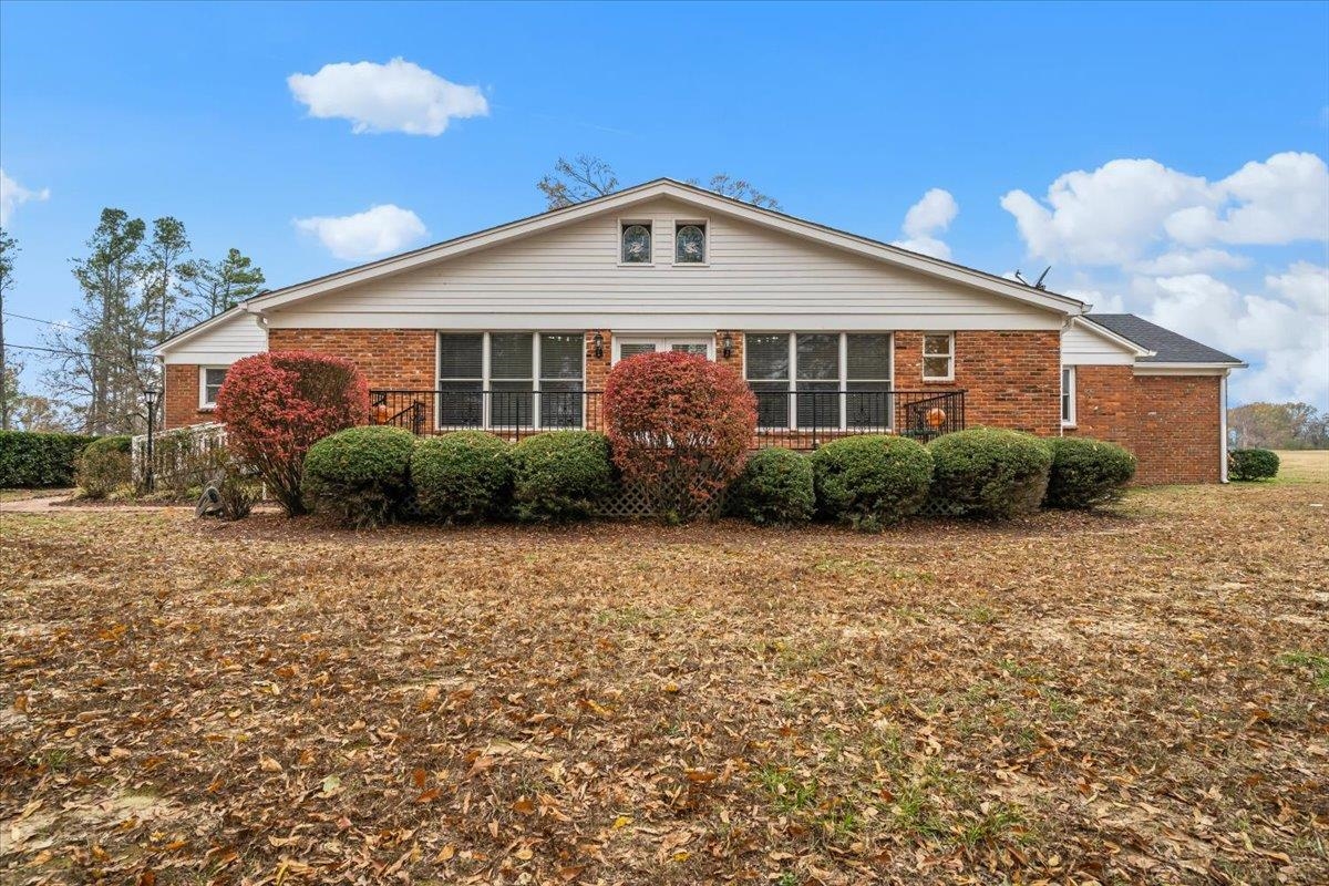 102 Linden Street Grand Junction, TN 38039 - Photo 31 of 37 Back of house featuring brick siding and a yard