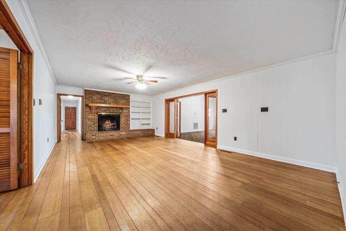 102 Linden Street Grand Junction, TN 38039 - Photo 5 of 37 Spacious living area with natural light and an easy flow into adjacent rooms, creating a warm and inviting atmosphere.