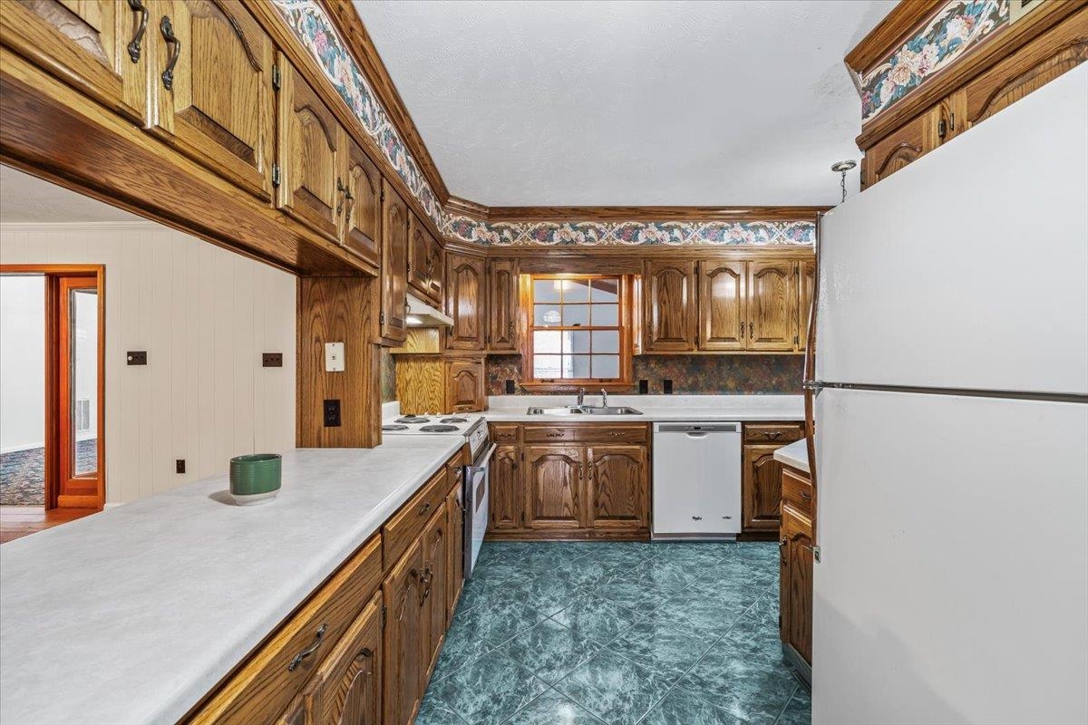 102 Linden Street Grand Junction, TN 38039 - Photo 7 of 37 Well-organized kitchen with ample storage and workspace, ideal for meal preparation and family gatherings.