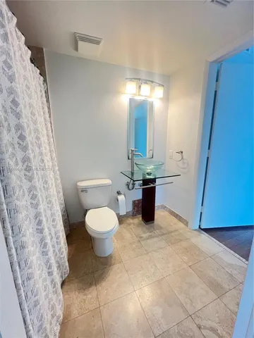 a view of a glass door and wooden floor