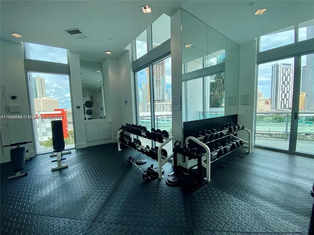 a room with a window and chandelier