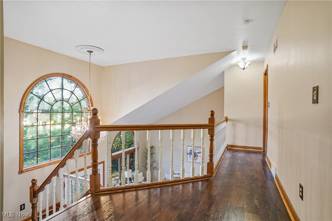 370 Wilcox Road Youngstown, OH 44515 - Photo 22 of 49 Hallway with wood finished floors and an upstairs landing