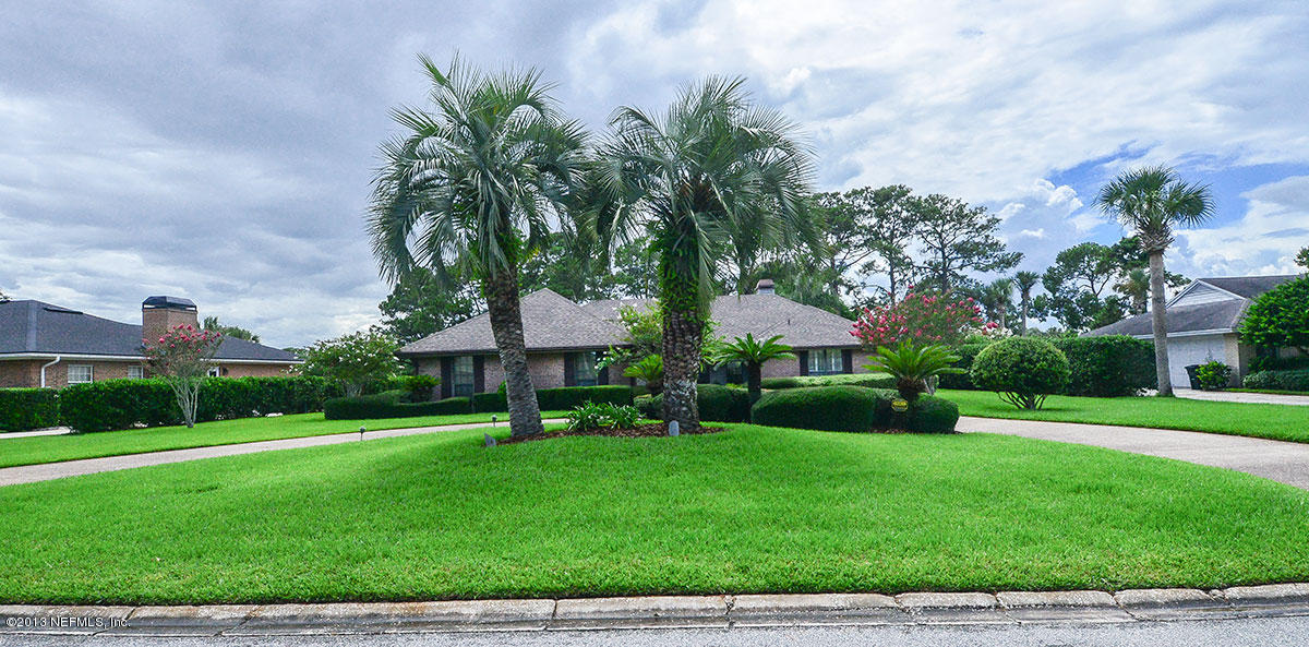 302 Pablo Road Ponte Vedra Beach, FL 32082 - Photo 1 of 28 a view of a yard with a house