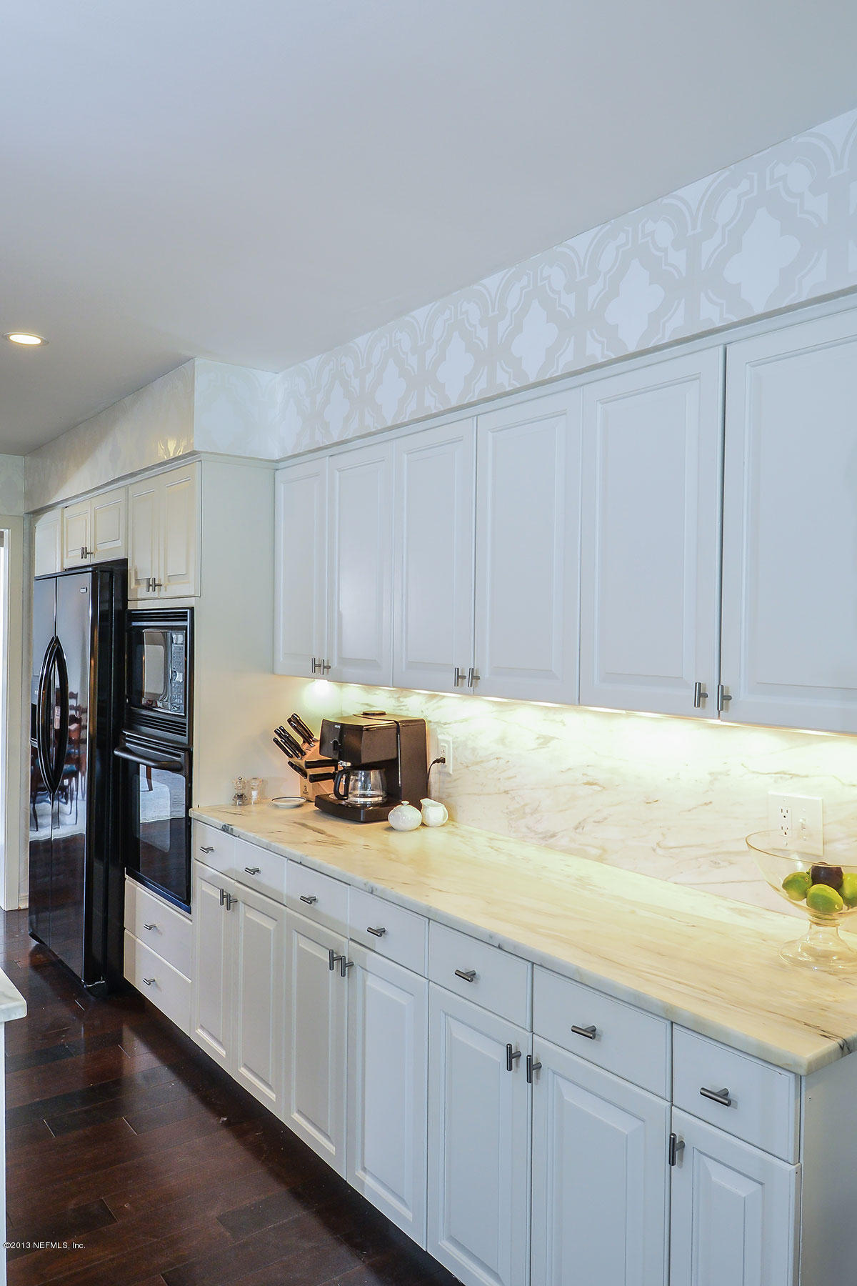 302 Pablo Road Ponte Vedra Beach, FL 32082 - Photo 13 of 28 a kitchen with stainless steel appliances granite countertop a sink a stove and cabinets