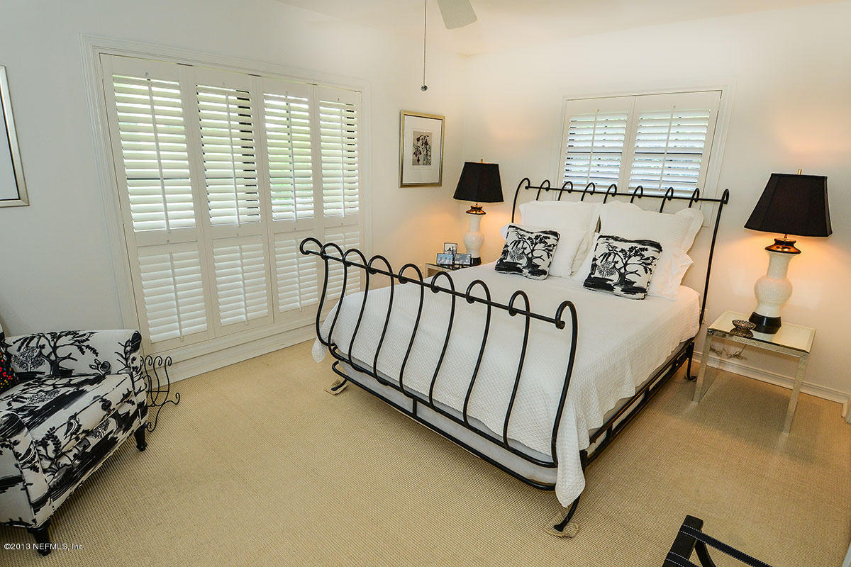 302 Pablo Road Ponte Vedra Beach, FL 32082 - Photo 17 of 28 a view of a bedroom with furniture and a window