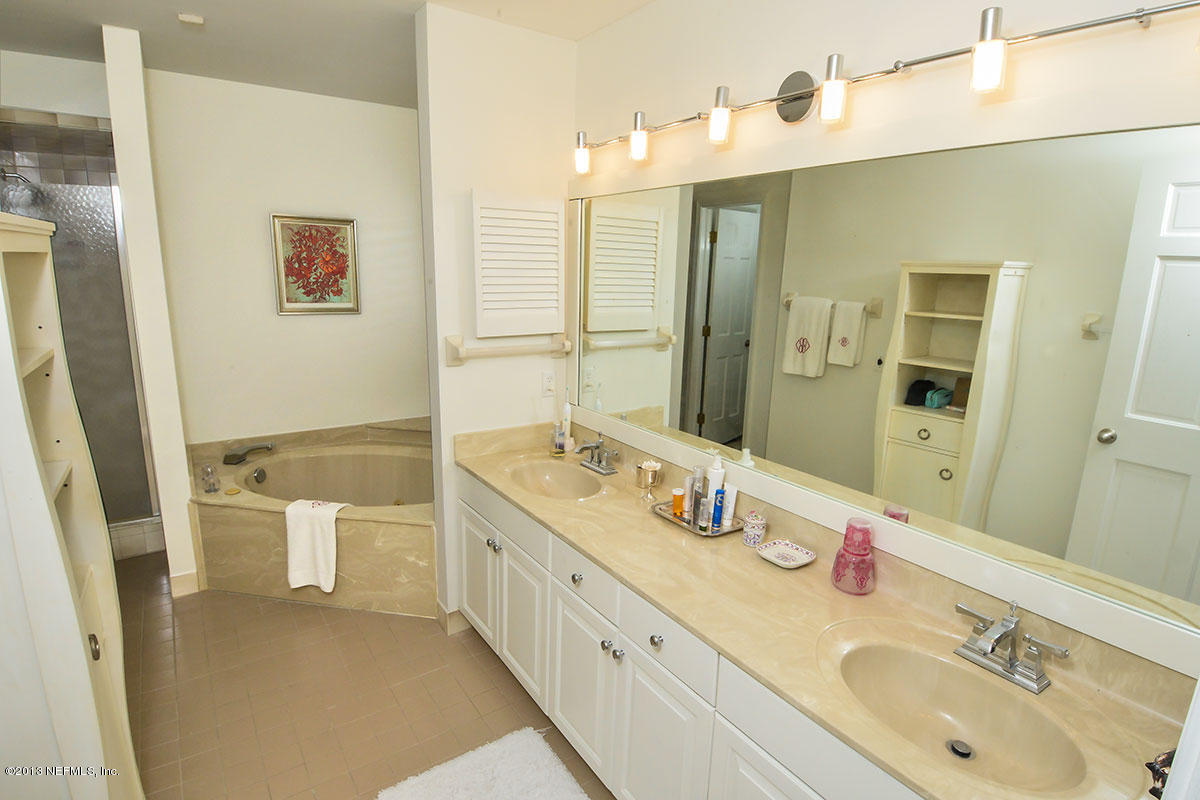 302 Pablo Road Ponte Vedra Beach, FL 32082 - Photo 22 of 28 a bathroom with a double vanity sink mirror double and shower