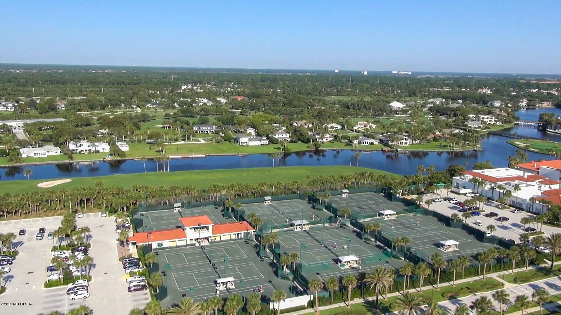302 Pablo Road Ponte Vedra Beach, FL 32082 - Photo 27 of 28 an aerial view of a city with lots of residential buildings ocean and mountain view in back