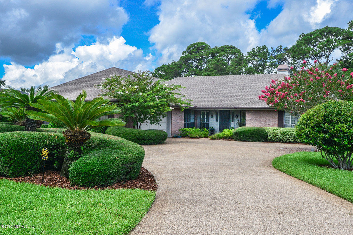 302 Pablo Road Ponte Vedra Beach, FL 32082 - Photo 3 of 28 a front view of house and yard with green space