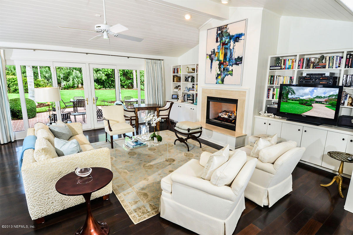302 Pablo Road Ponte Vedra Beach, FL 32082 - Photo 6 of 28 a living room with furniture and a fireplace
