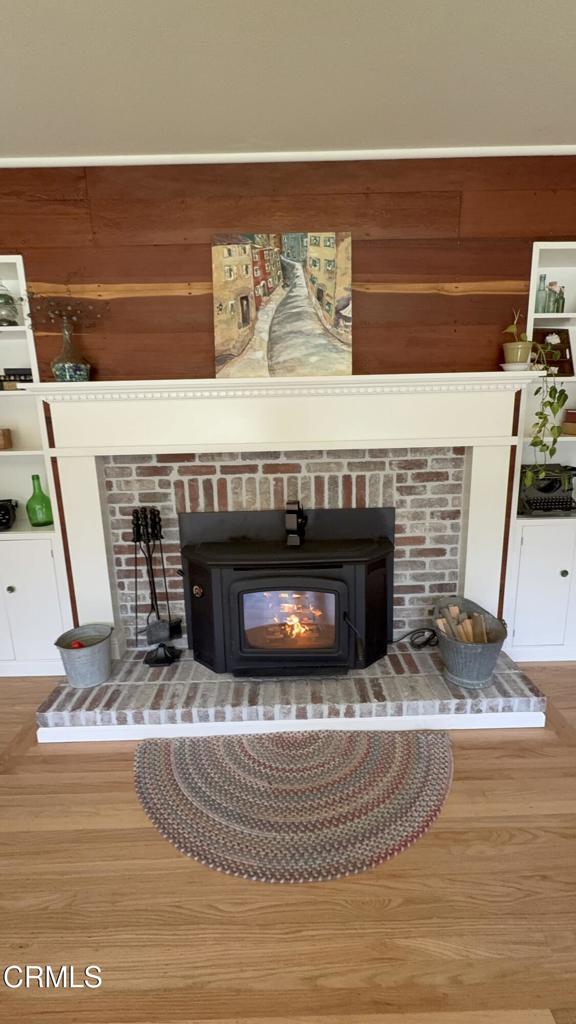 31400 Sherwood Road Fort Bragg, CA 95437 - Photo 2 of 55 a living room with fireplace and a wooden floor