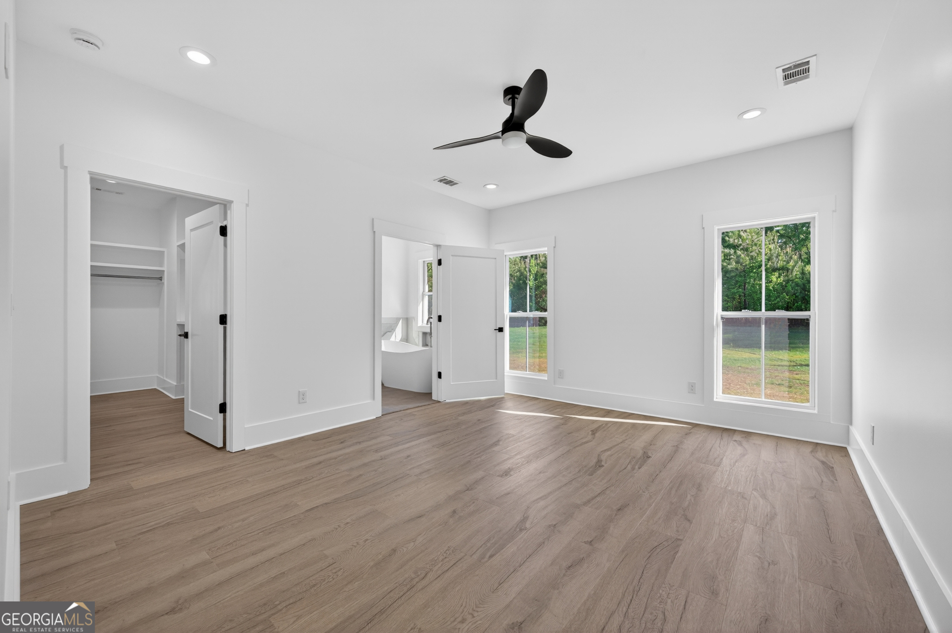 1455 Laney Drive Locust Grove, GA 30248 - Photo 15 of 37 a view of empty room with wooden floor and window