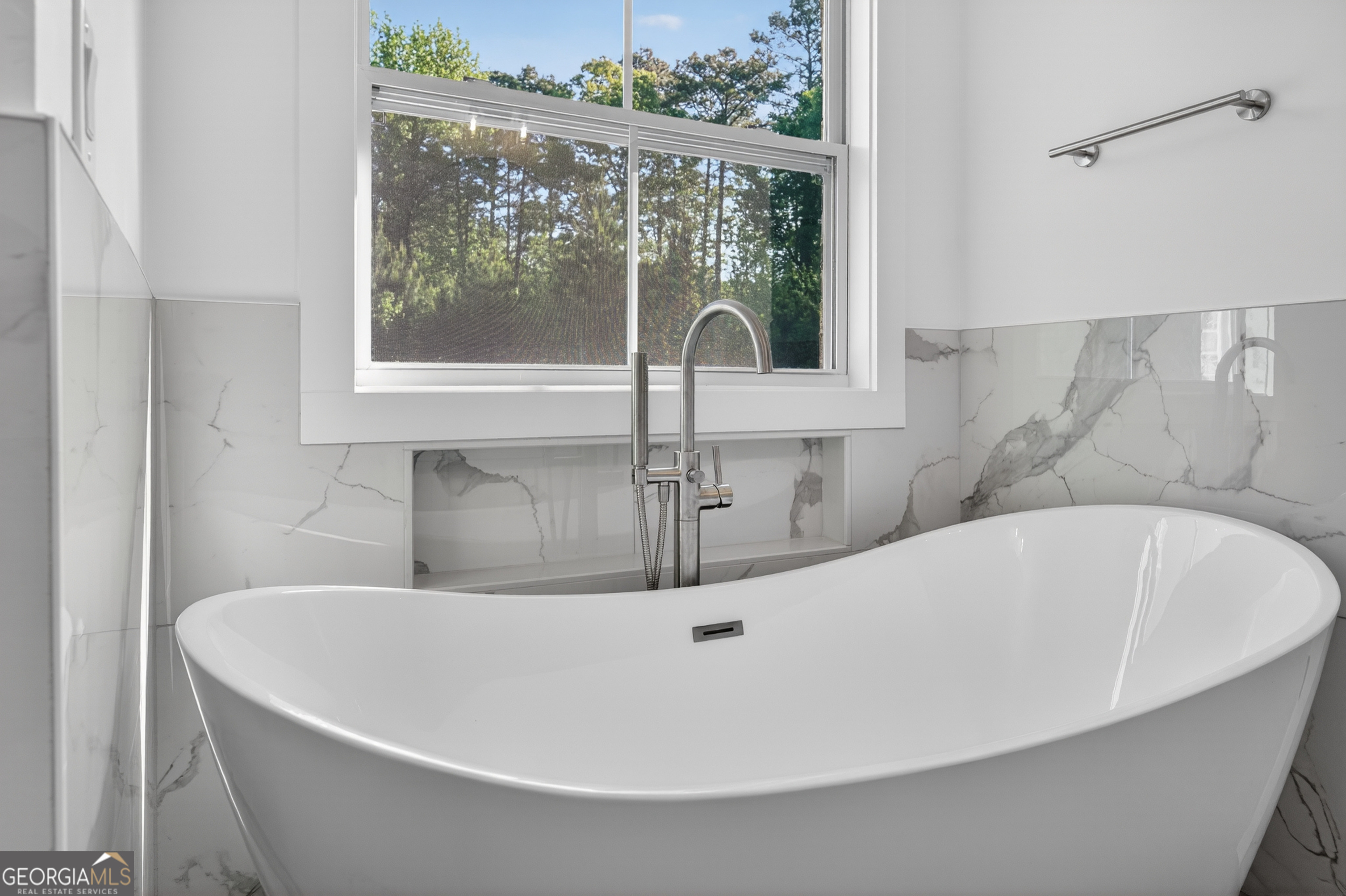 1455 Laney Drive Locust Grove, GA 30248 - Photo 18 of 37 a white bath tub sitting in a bathroom
