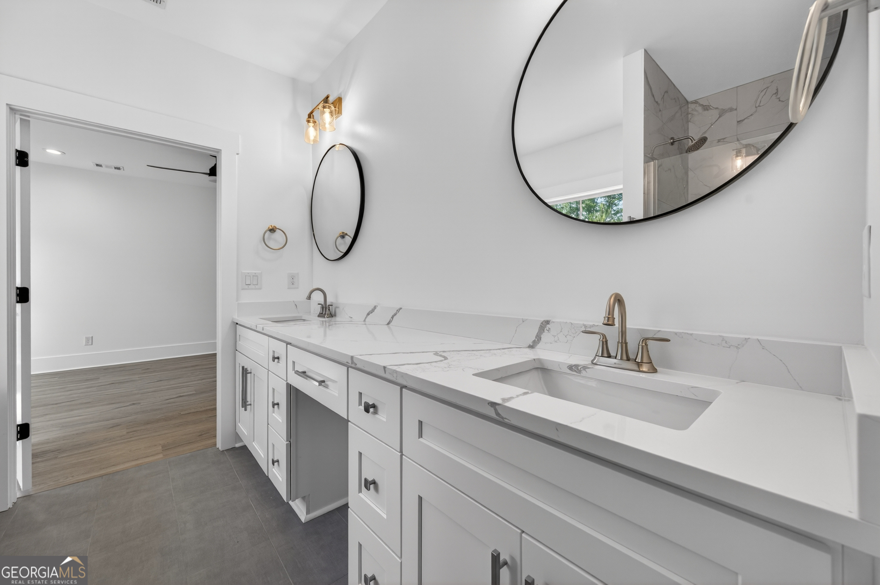 1455 Laney Drive Locust Grove, GA 30248 - Photo 19 of 37 a bathroom with a double vanity sink and a mirror