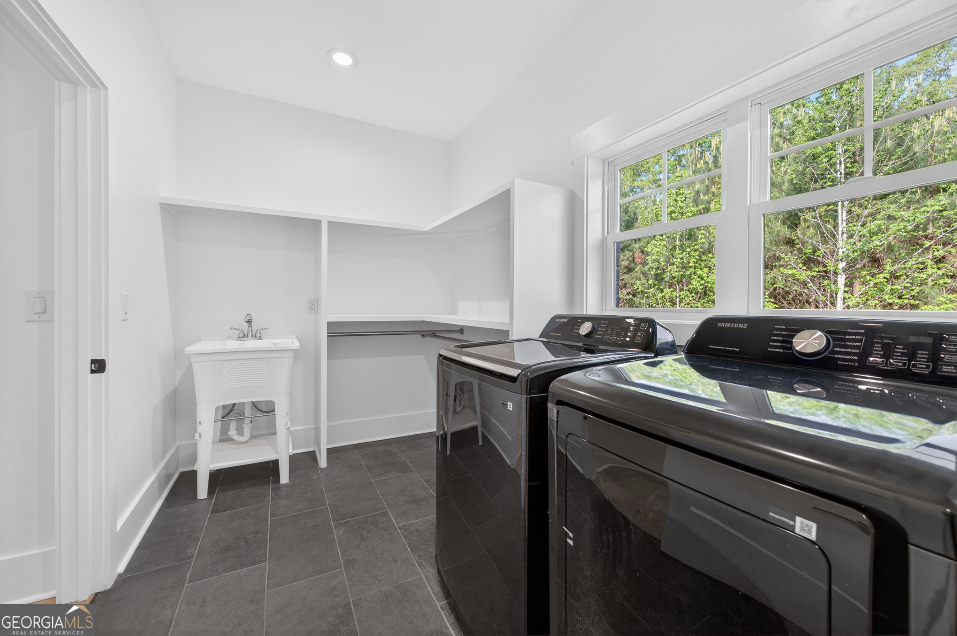 1455 Laney Drive Locust Grove, GA 30248 - Photo 21 of 37 a kitchen that has a sink and a stove