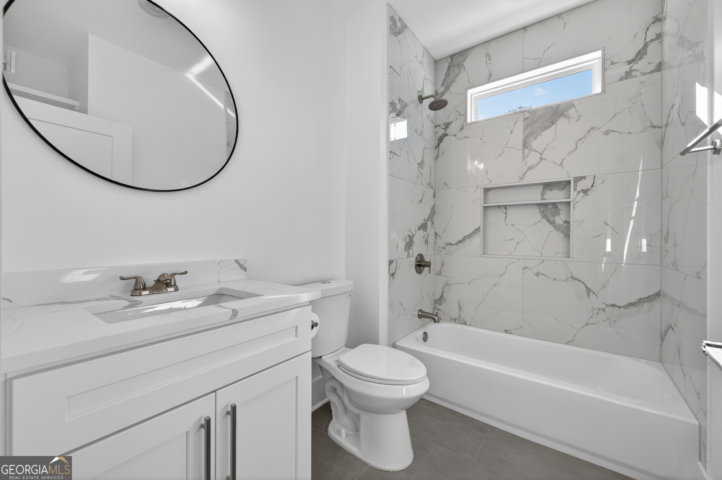 1455 Laney Drive Locust Grove, GA 30248 - Photo 25 of 37 a bathroom with a sink a toilet and a mirror