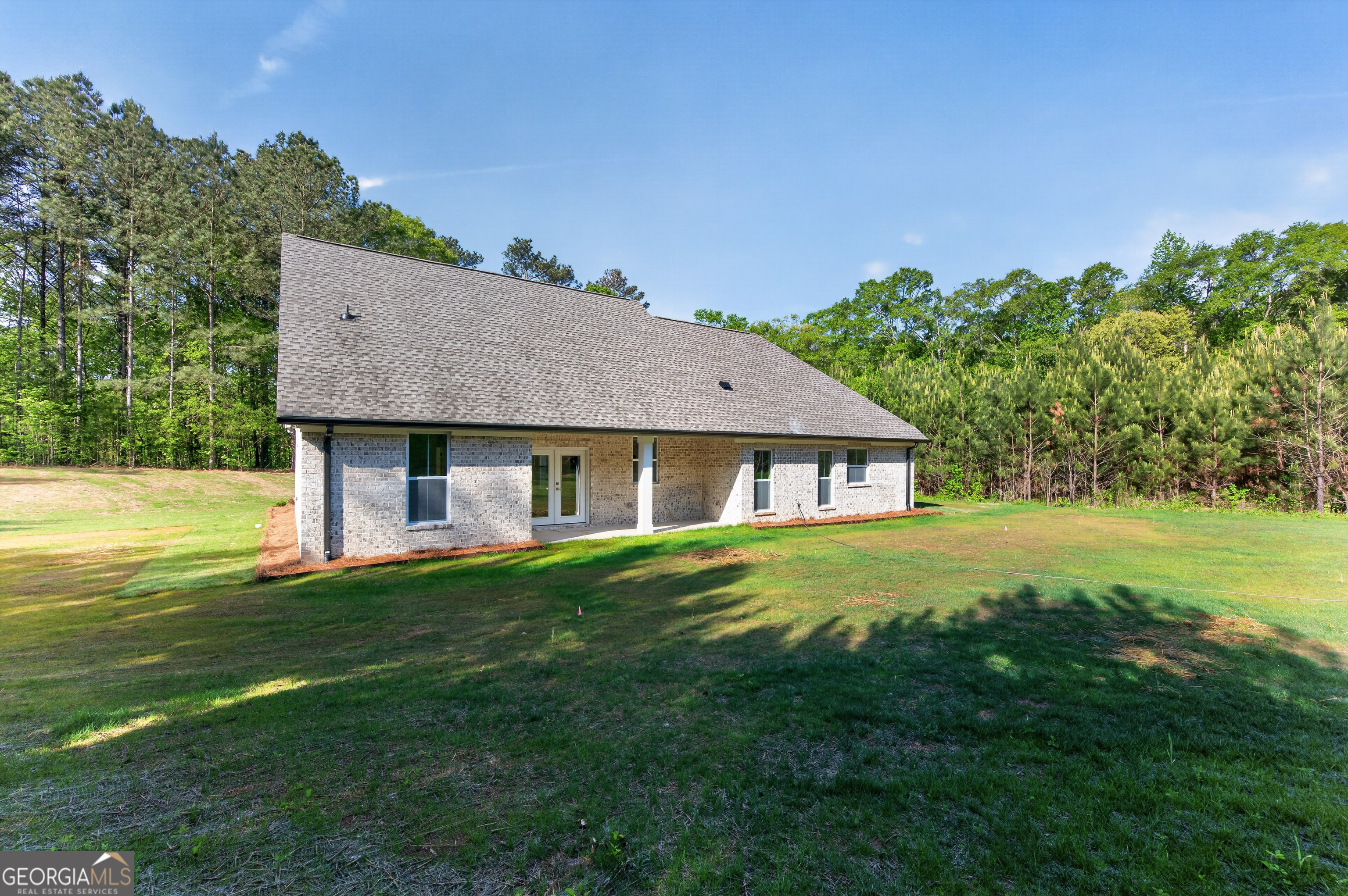 1455 Laney Drive Locust Grove, GA 30248 - Photo 31 of 37 a front view of a house with a yard