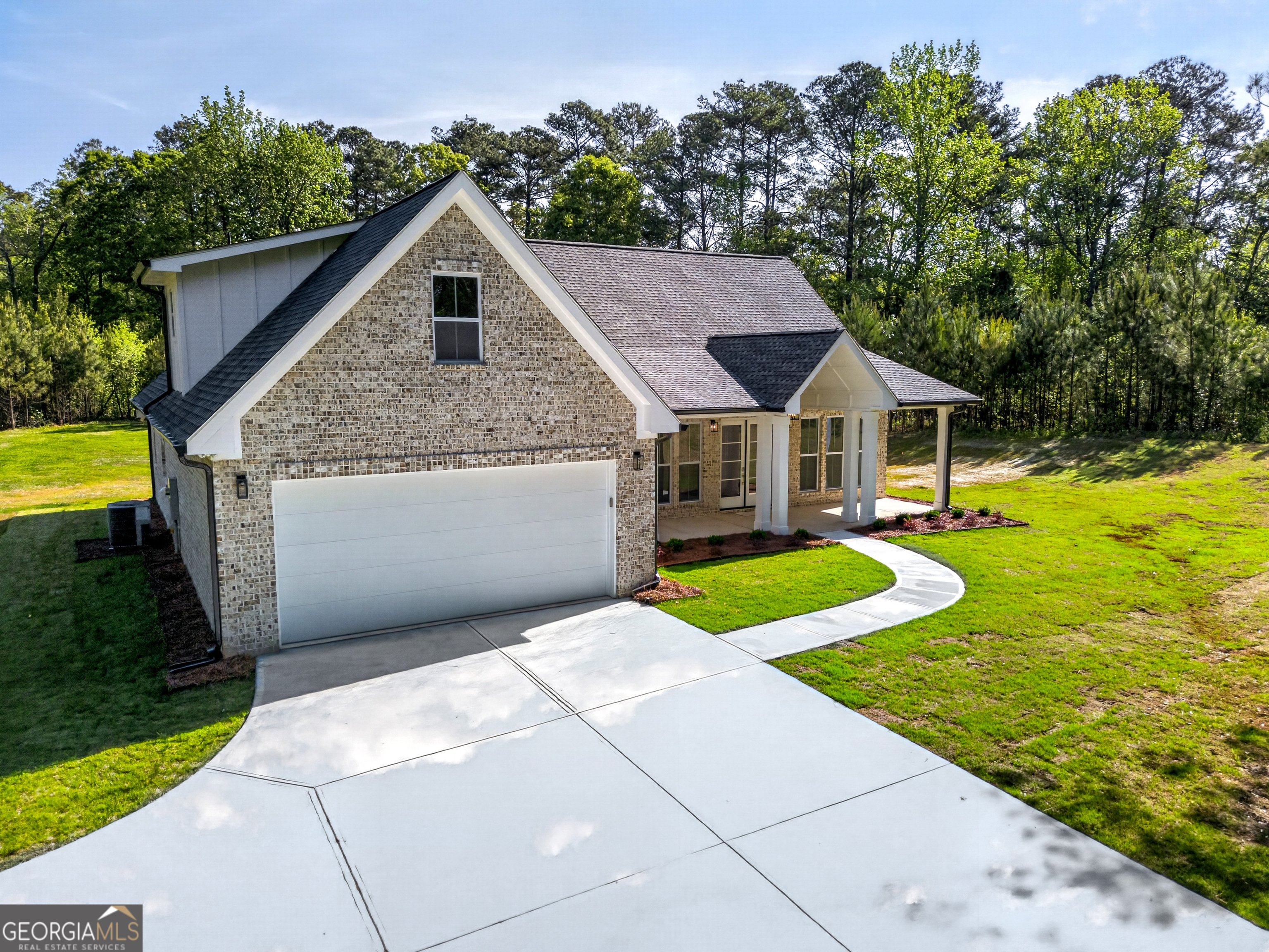 1455 Laney Drive Locust Grove, GA 30248 - Photo 32 of 37 a front view of house with yard and green space