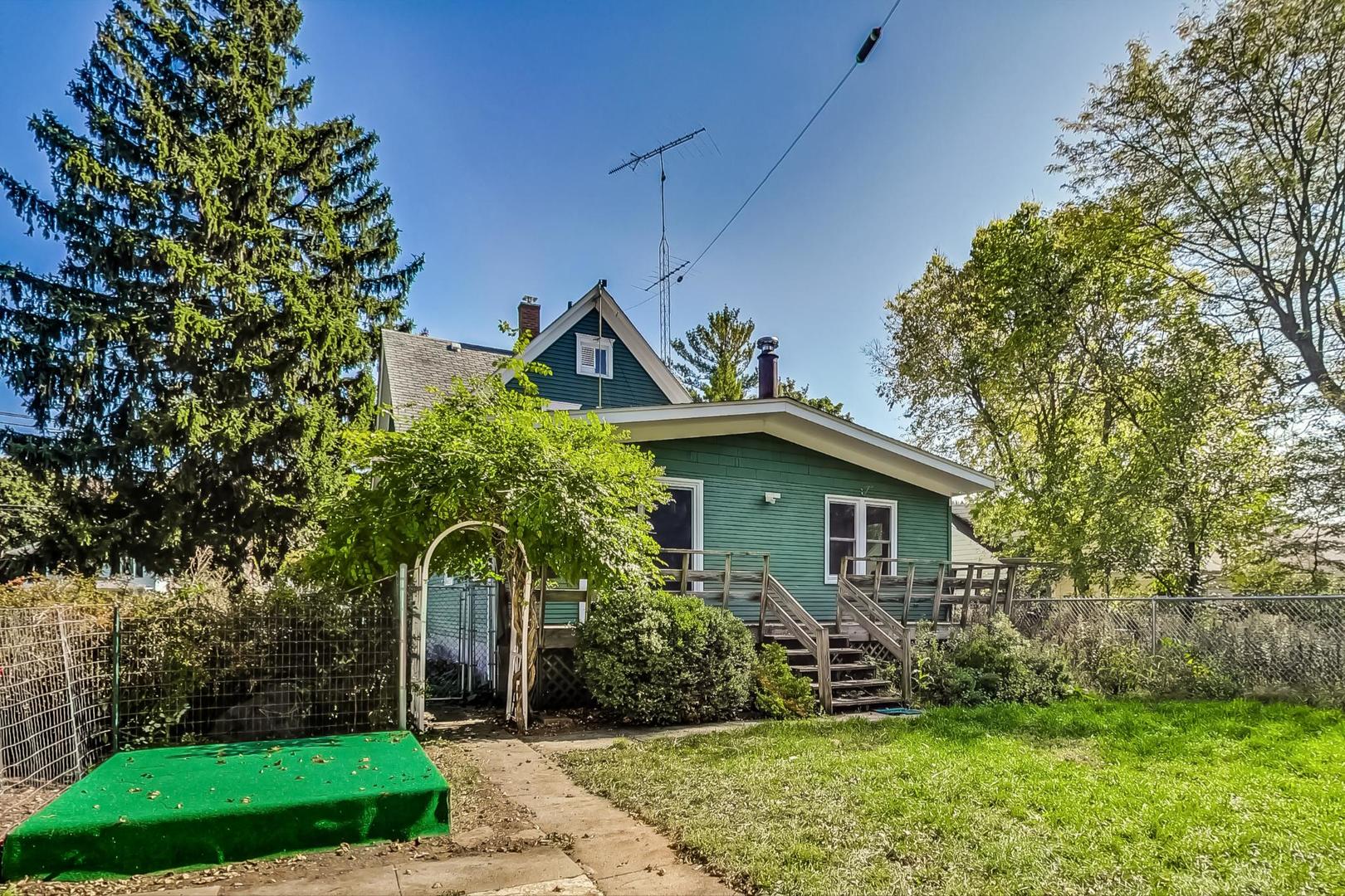 703 Normal Road DeKalb, IL 60115 - Photo 54 of 75 a front view of a house with garden