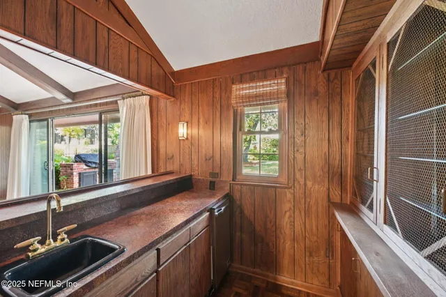 a view of a swimming pool with a yard