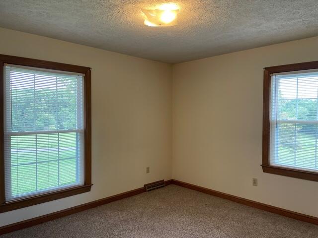 78 Robertson Ridge Road Axton, VA 24054 - Photo 14 of 22 an empty room with a window