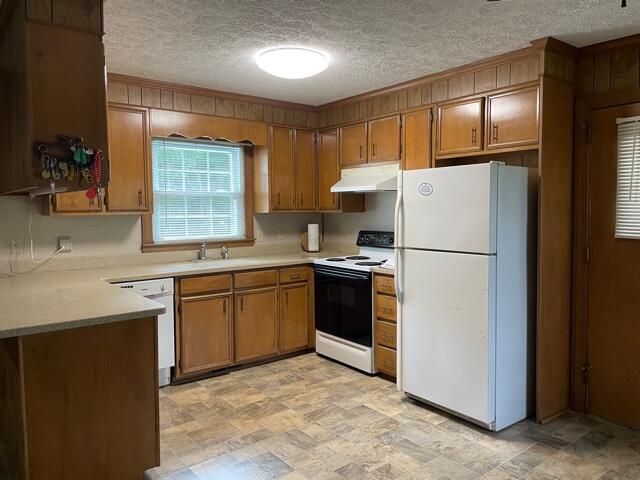 78 Robertson Ridge Road Axton, VA 24054 - Photo 3 of 22 a kitchen with a refrigerator sink and cabinets