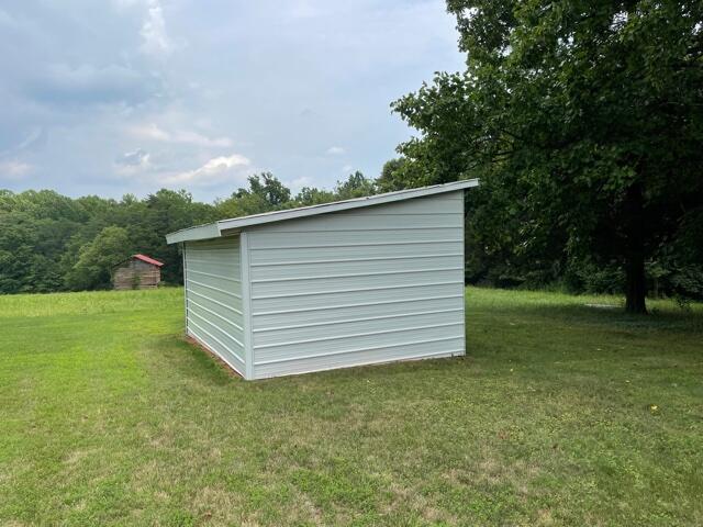 78 Robertson Ridge Road Axton, VA 24054 - Photo 22 of 22 a view of a backyard with large trees