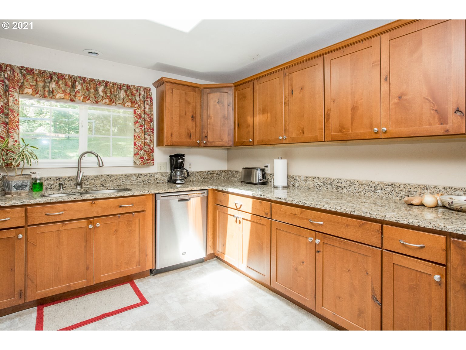 90361 Baker Road Elmira, OR 97437 - Photo 11 of 26 a kitchen with stainless steel appliances granite countertop a sink stove and cabinets