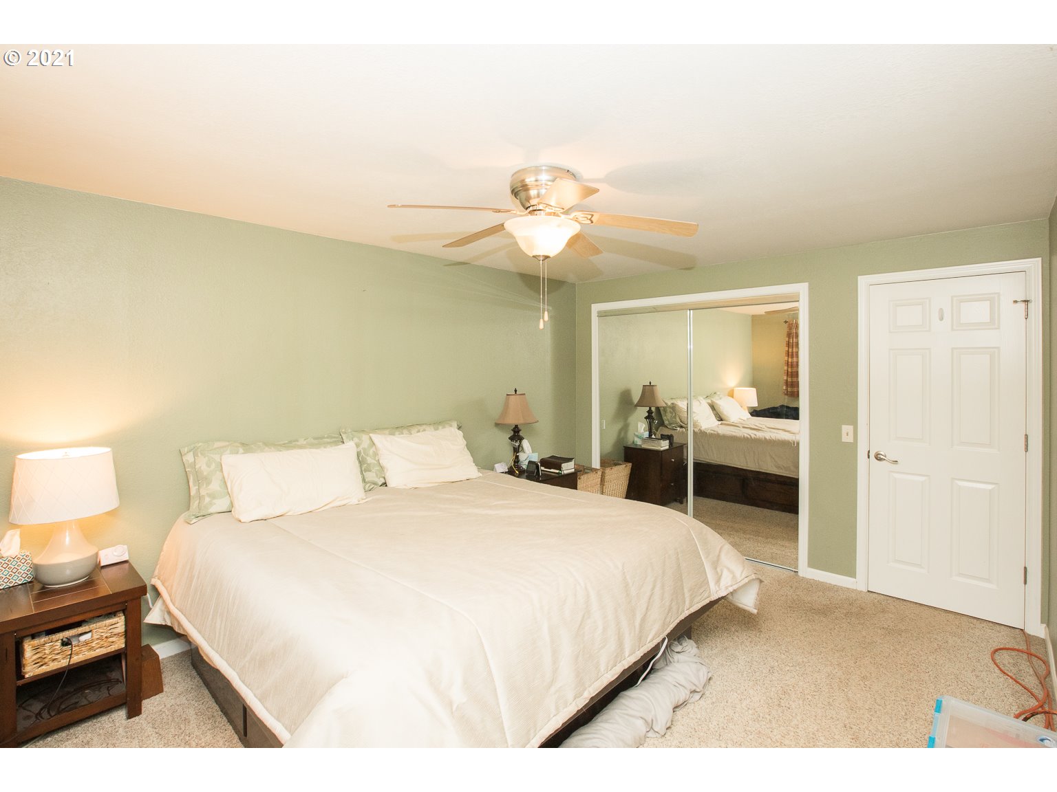90361 Baker Road Elmira, OR 97437 - Photo 13 of 26 a spacious bedroom with a bed and a chandelier