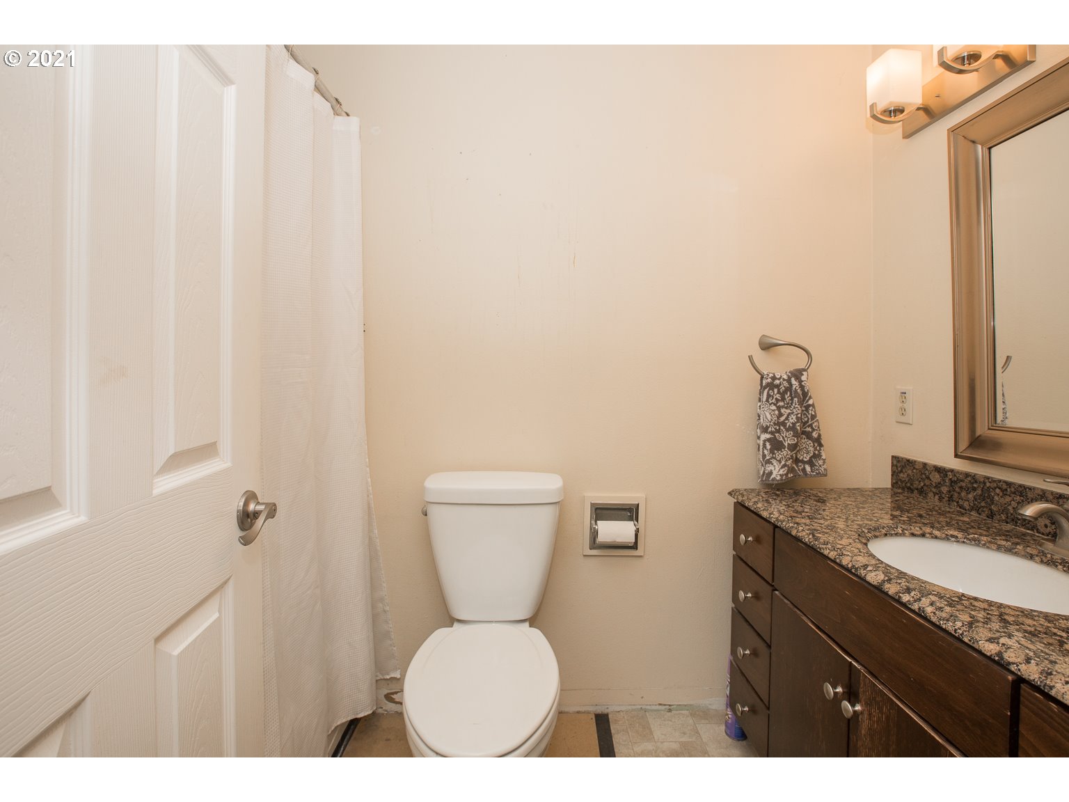 90361 Baker Road Elmira, OR 97437 - Photo 16 of 26 a bathroom with a granite countertop sink toilet and mirror