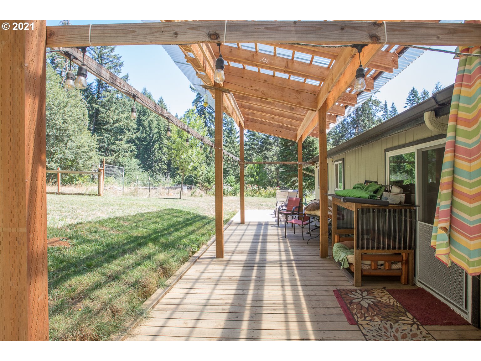 90361 Baker Road Elmira, OR 97437 - Photo 17 of 26 a view of a porch with a backyard