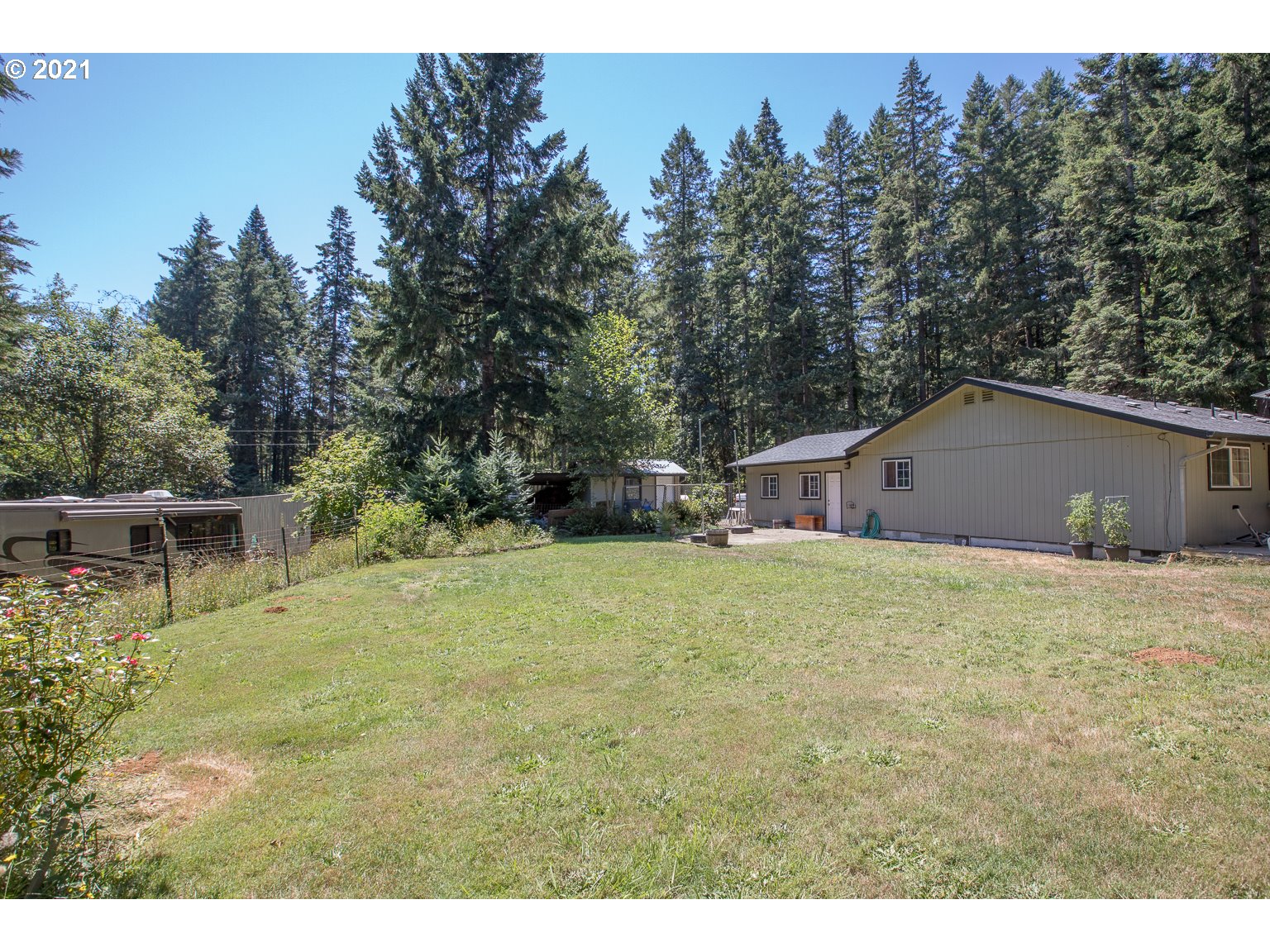 90361 Baker Road Elmira, OR 97437 - Photo 20 of 26 a backyard of a house with table and chairs