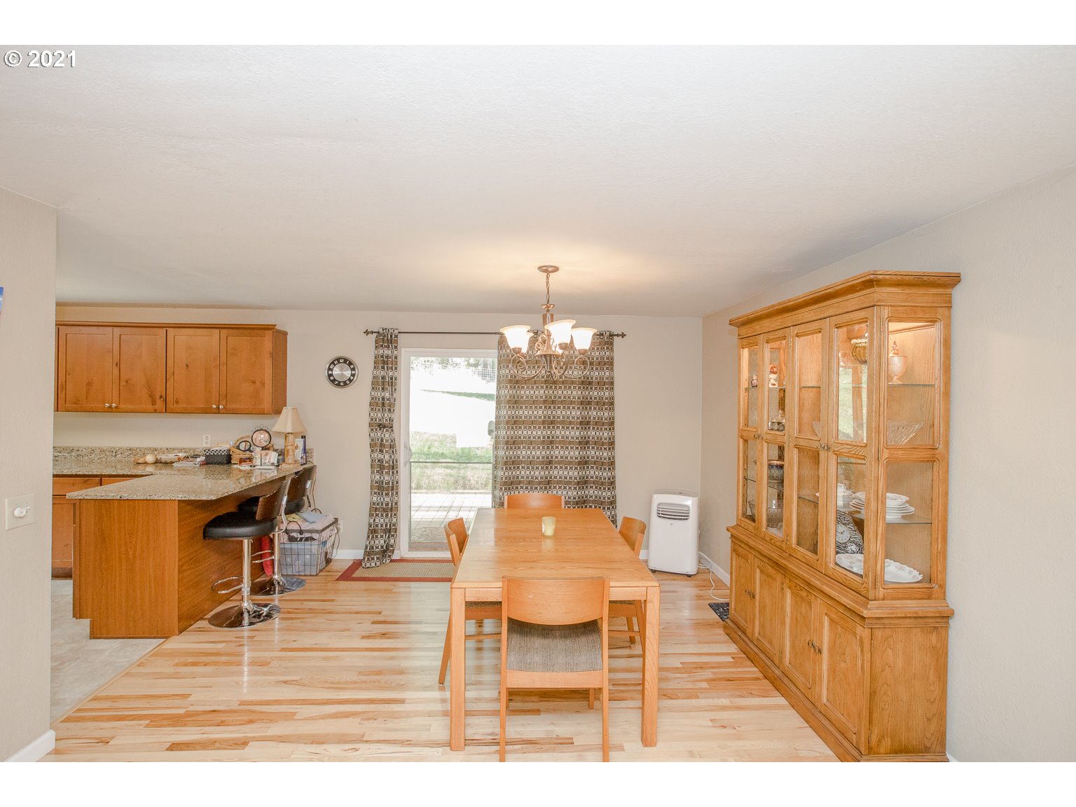 90361 Baker Road Elmira, OR 97437 - Photo 6 of 26 a living room with furniture and a flat screen tv