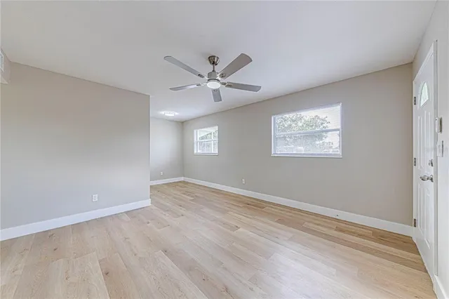 a view of an empty room with a window