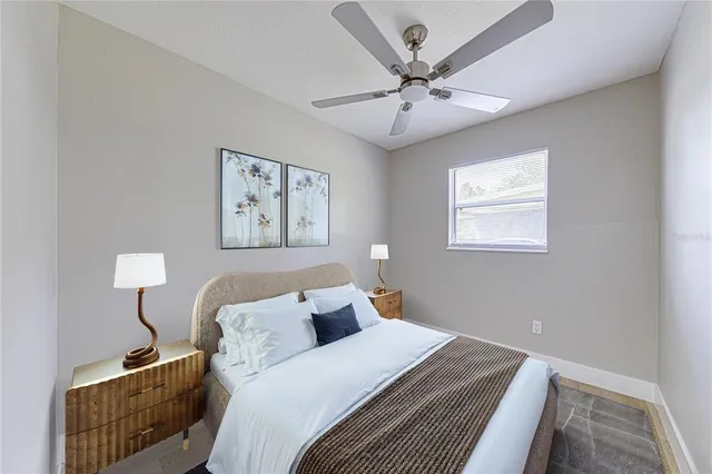 a bedroom with bed and window