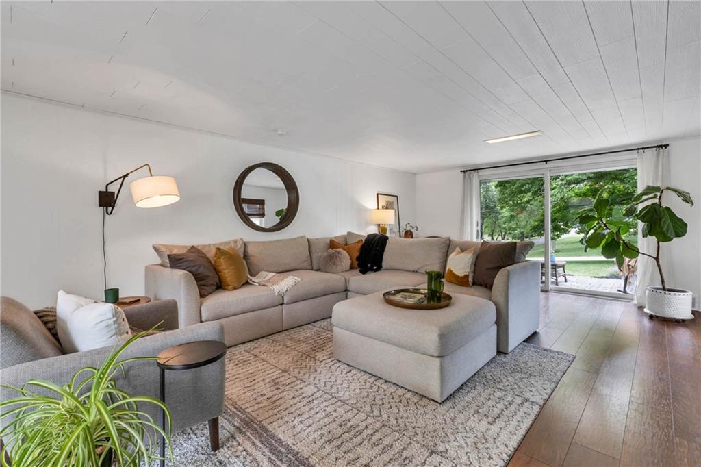 139 Laurel Drive Beaver, PA 15009 - Photo 22 of 46 a living room with furniture a rug potted plant and a large window