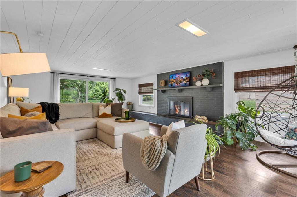 139 Laurel Drive Beaver, PA 15009 - Photo 23 of 46 a living room with furniture a fireplace and a flat screen tv