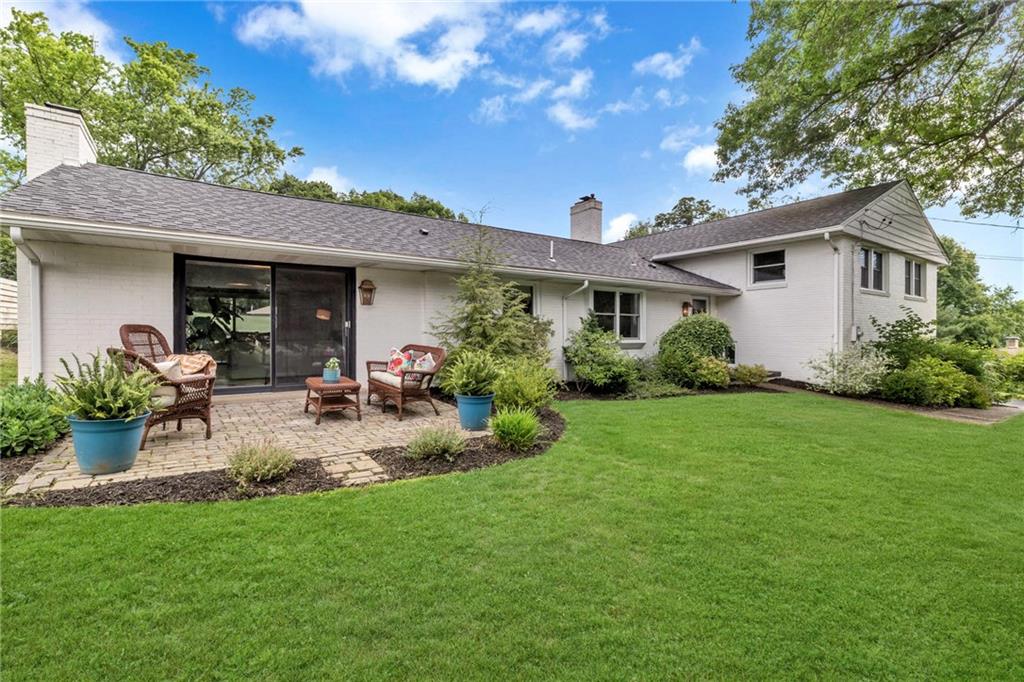 139 Laurel Drive Beaver, PA 15009 - Photo 5 of 46 a view of a patio with table and chairs potted plants and a large tree