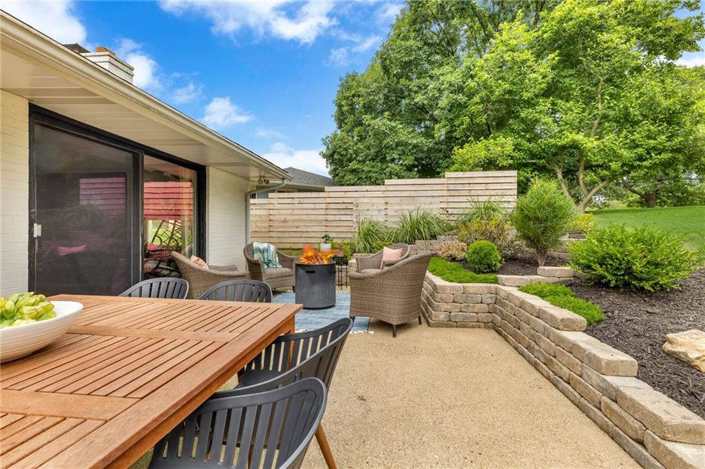 139 Laurel Drive Beaver, PA 15009 - Photo 7 of 46 a view of a patio with table and chairs potted plants with wooden floor and fence