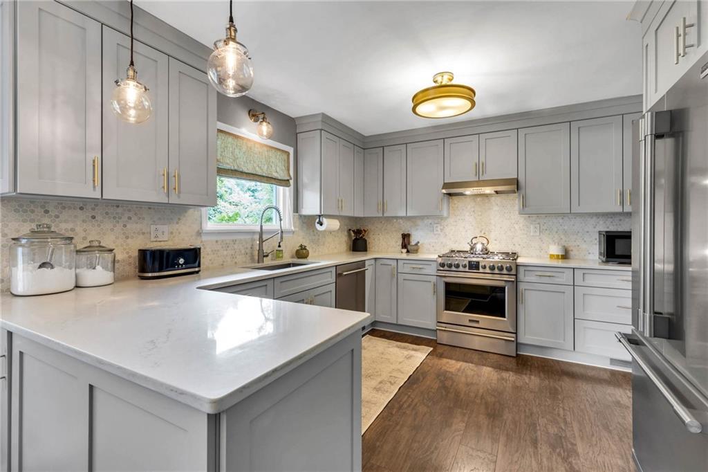 139 Laurel Drive Beaver, PA 15009 - Photo 10 of 46 a kitchen with a stove a sink a refrigerator and a stove