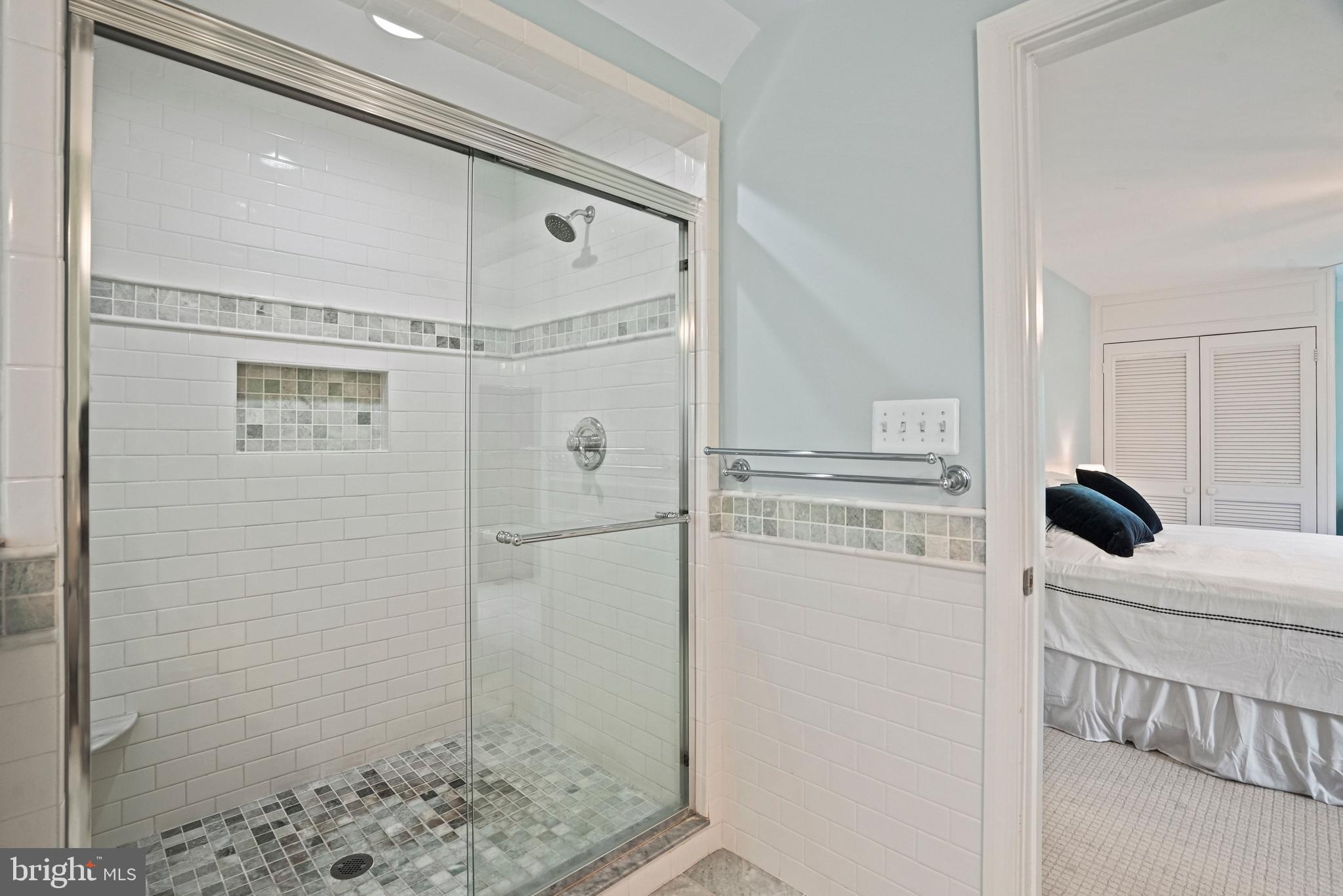 1907 Brisbane Street Silver Spring, MD 20902 - Photo 20 of 39 a bathroom with a shower and mirror