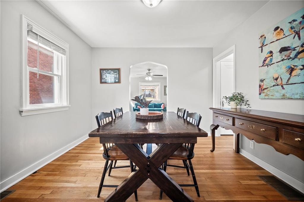 416 Phillips Avenue McKees Rocks, PA 15136 - Photo 11 of 46 a view of a dining room with furniture window and wooden floor