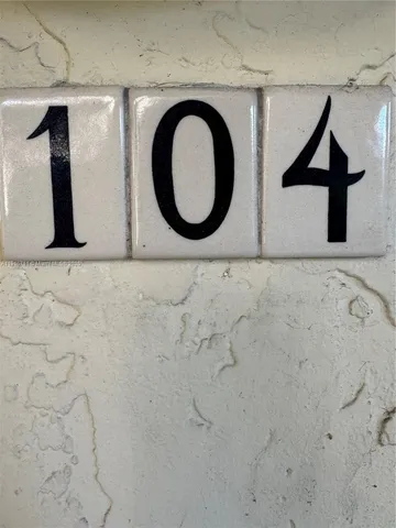 a view of a yard with wooden fence